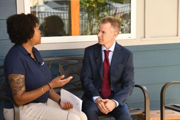 Development Director being interviewed about the NET-zero building on campus