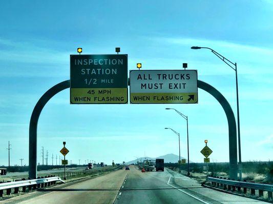 Cars stay in left lane/main highway. Trucks, buses, commercial, recreational vehicles exit right.