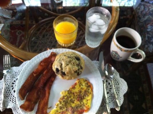 Fresh baked muffin, crisp Iowa baco, eggs with fresh herbs and garden tomatoes, and coffee, tea and juice!