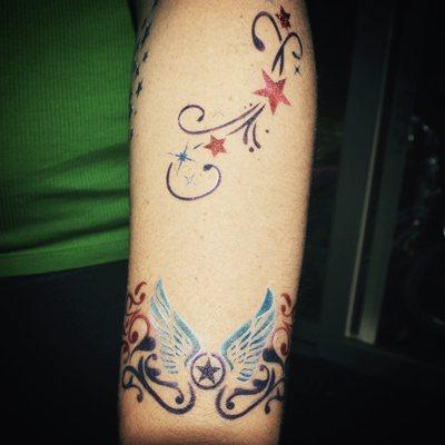 Shooting Stars and wing airbrush tattoo