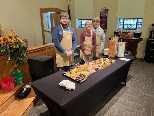 Youth serving a meal on homecoming Sunday