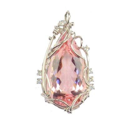 Ultra feminine and romantic, this stunning pendant features a 35.96ct pear cut morganite.