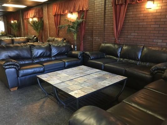 Leather couches with stone tables :)