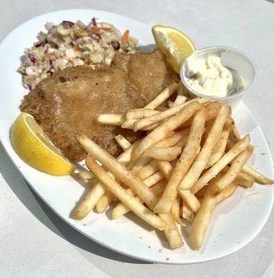 Fish and chips with shoestring potatoes, homemade coleslaw and homemade tartar sauce.