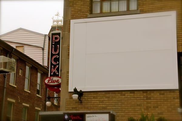 Watch sports on the big screen projector outside