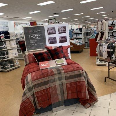 Bed display in the back of the store.