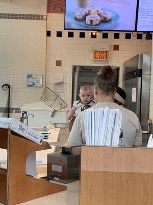 Brought a baby over the counter to play while tons of people in line.