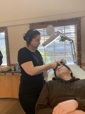 My son Gavin getting his brows done for the first time