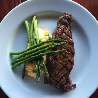 Steak on Thursday -- $13 for a 10oz New York strip, baked potato, and veggie (currently asparagus with whiskey and butter). Mmn!