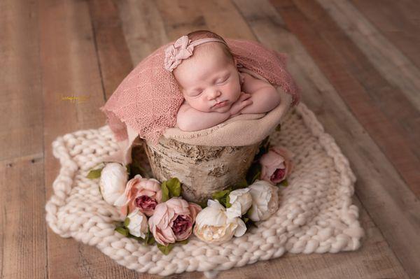 Newborn girl in studio.