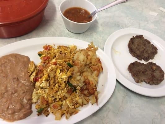 Migas a la mexicana plate with sausage added