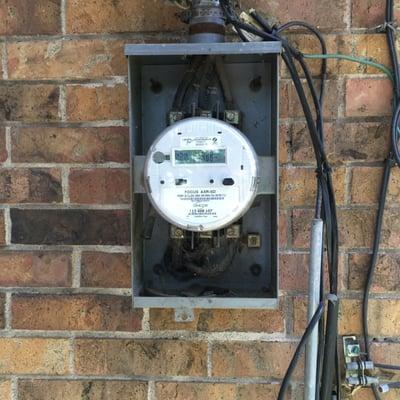 New Oncor Electric Delivery smart meter & 1963 model meter base that we upgraded recently.