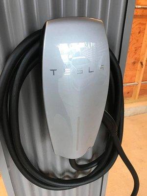 Tesla electric vehicle charging station. Licensed electrician. Electric vehicle charging station. Handyman electrical services.