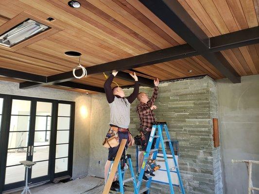 Cedar soffits being installed.