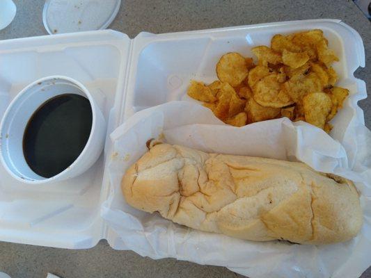 French dip sandwich, au jus, and chips