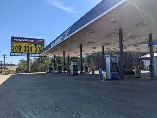 Outside the gas station. Giant gas prices street sign. Can be seen from highway.