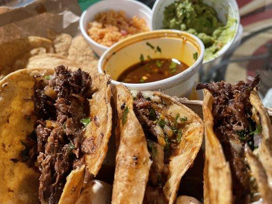 Three Birria taco plate, consome, rice, chips & guac