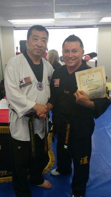 Getting 5th Dan Certificate from Master Han.