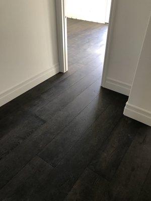 Wood flooring at entry to bedroom.