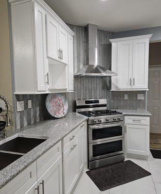 White shaker cabinets with stainless steel pulls