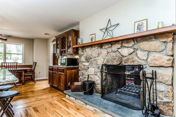 Double sided fireplace in Kitchen and Family Room. (Kitchen View)