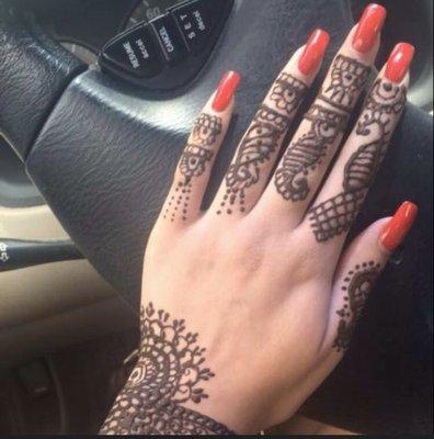 We offer Henna on request, the nails are Backscratcher Acrylic with Opi big apple red