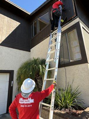 The Guys fixing the siding damaged due to weathering. Home protected before the rains! Always 2 guys on a ladder, safety first! ‍‍