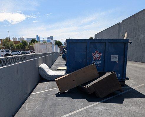 Furniture dumped in parking spaces.