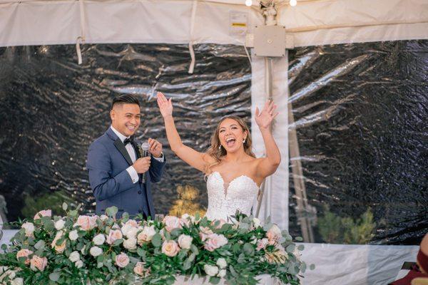 Repurposed floral arrangement from ceremony to sweetheart table