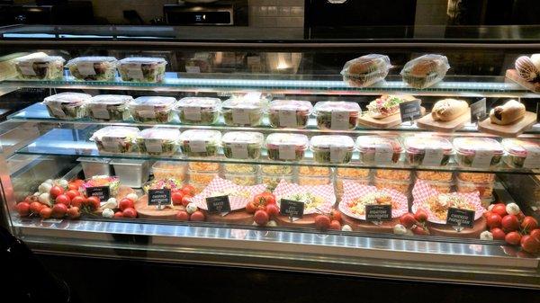 Subs, salad and pasta dishes on display.