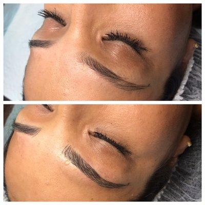 Defining her natural brow with hair strokes