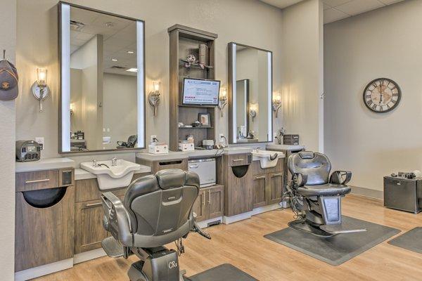 Luxurious men's salon designed like an executive club-level lounge, complete with adult refreshments!