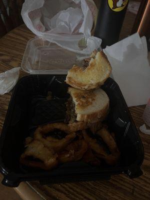 A melt sandwich it is steak, really greasy and onion rings are burnt really greasy