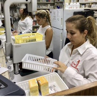 The pharmacist and their staff