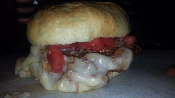 Smoked rib meat with creamy white cheddar,  tomatoes from Brays produce in Bedford on a hearty kaiser bun!