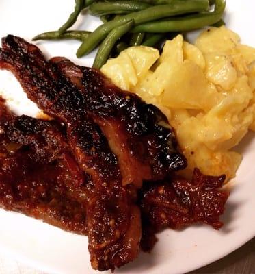 Applewood smoked, and brown sugar glazed spare ribs, with scalloped potatoes, and fresh green beans.