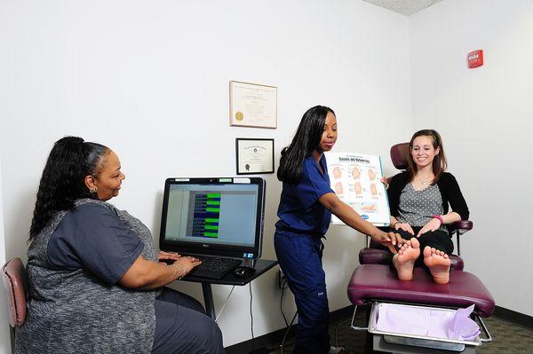 Dr. Stacia Jones, DPM examining a patient.