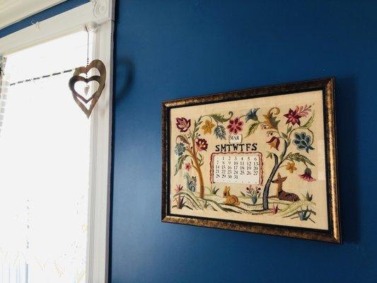 Vintage crewel embroidery calendar art creatively reframed by The Frame Man