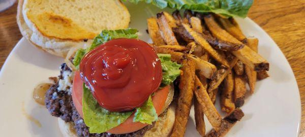 My burger on toasted bun with fries, which I've already topped with the lettuce loaded with ketchup, sorry