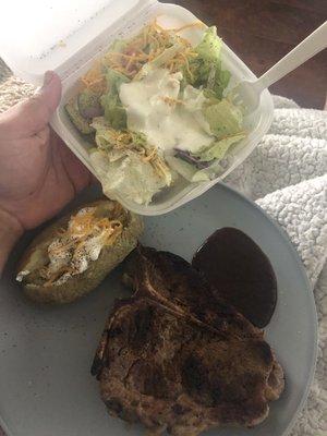 Tiny but yummy baked potato, well over cooked TBone and a nice size salad meal.