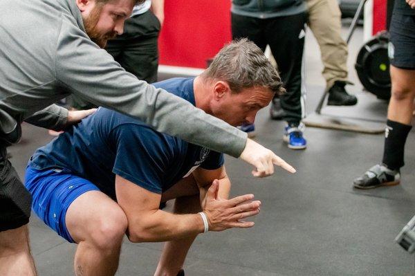 Brent Carter coaching the squat