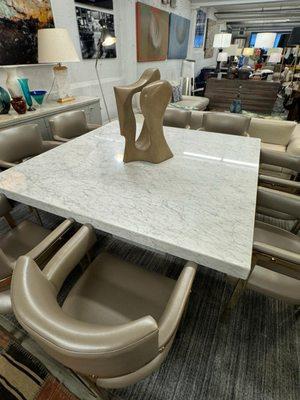 Maurice Villency marble table, Jamie chairs by Artistic Frame, and a captivating Robert Winslow marble sculpture, and an ABC Home Area Rug.