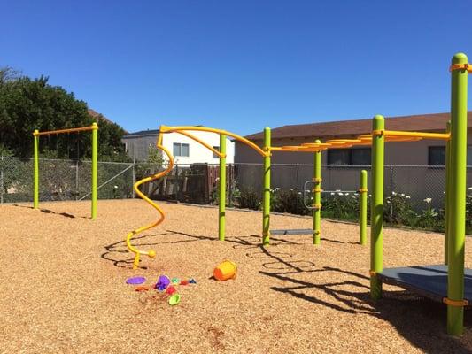 Monkey bars and swings for children 5-12 years old.