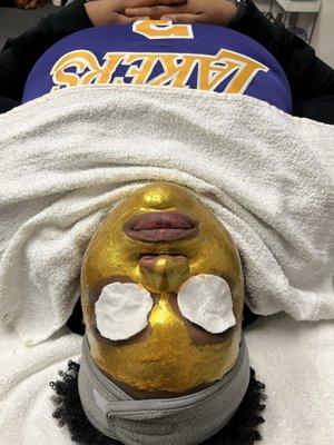 Gold facial on student