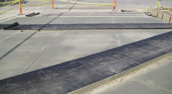 Brand new concrete driveway awaiting brick ribbon