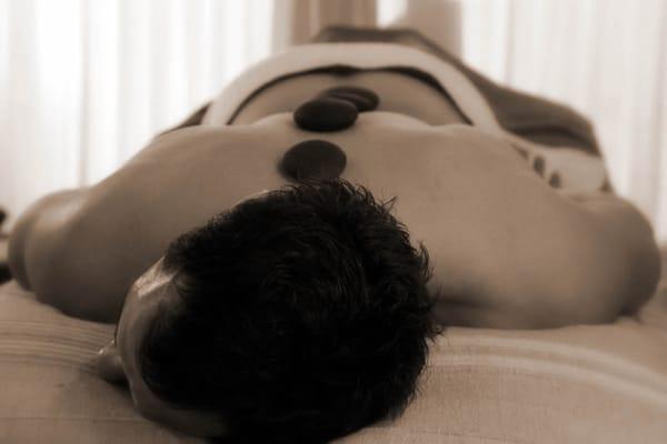 Hot stone massage for tension and aches.