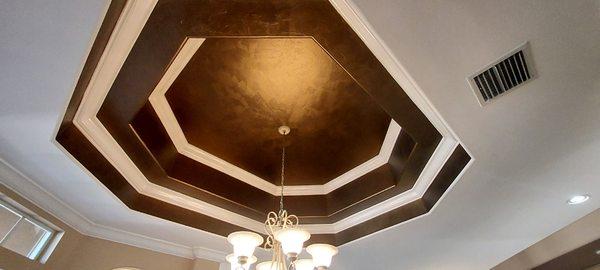 Coffer ceing in dining room was faux finished using metallic bronze paint.