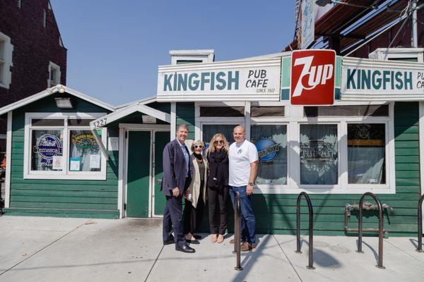 TMC team standing in front on Kingfish with owner, Emil Peinert. Kingfish was relocated and re-opened after obtaining financing from TMC.