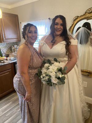 Mother of the bride & bride in the bridal party suite.