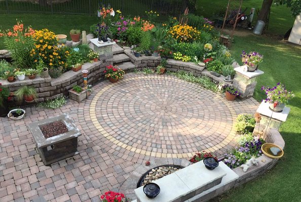 Completed patio with surrounding landscaping.